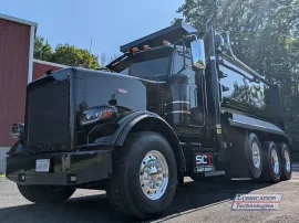 Peterbilt 378 Tri-Axle Dump Truck equipped with a remote lubrication system.