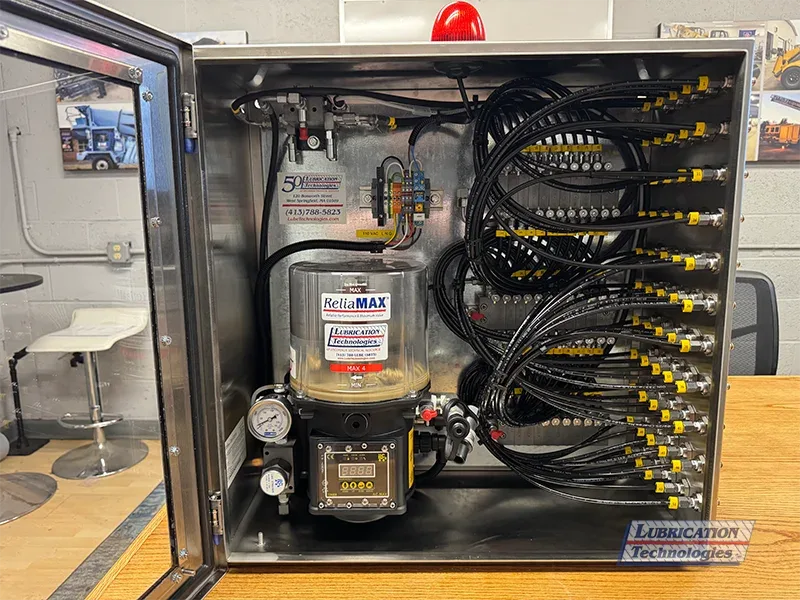 ReliaMAX™ 4 kg automatic lubrication system mounted inside a stainless steel NEMA 4X enclosure for a paper machine press section application